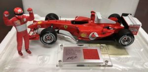 Hotwheels Ferrari F2004 Schumacher Race suit Ed 1:18